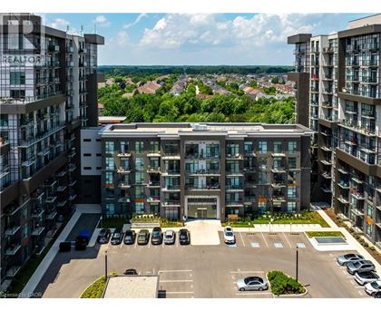 A large building with a parking lot in front of it.