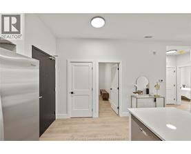 A spacious, well-lit room with a large white counter and a wooden bench.