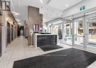 The image shows the interior of a realtor's office with a reception desk and glass doors.