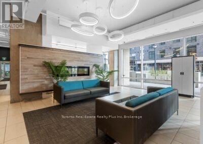 A modern waiting area with a wooden wall and a blue couch.