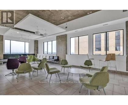 A room with a lot of chairs and a table.