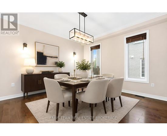 A dining room with a wooden table and chairs.