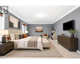 A bedroom with a large bed, a couch, a dresser, and a television.