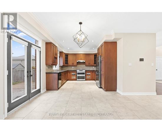 A large, open kitchen with wooden cabinets and a central island.