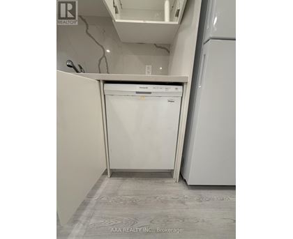 A white dishwasher is in the kitchen.