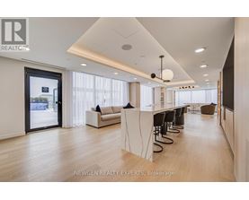 A spacious office with a long table and chairs.