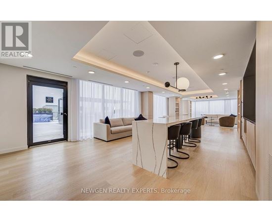 A spacious office with a long table and chairs.