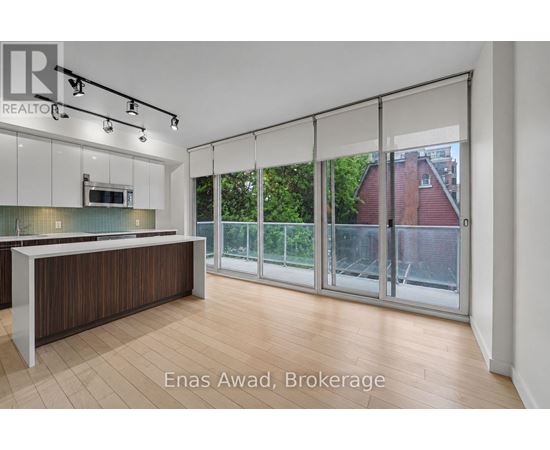 A spacious office with a reception desk and sliding glass doors.