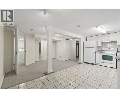 A realtor's office with a kitchen area.