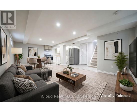 A well-lit, modern living room with a grey sofa and a wooden coffee table.