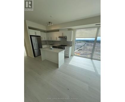 A modern kitchen with a view of the city.