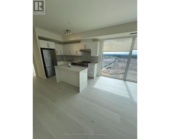 A modern kitchen with a view of the city.