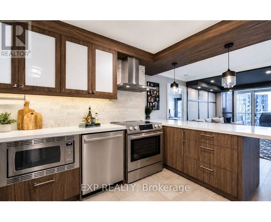A modern kitchen with wooden cabinets and stainless steel appliances.