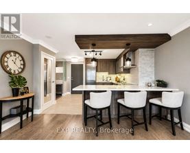 A modern kitchen with a dining table set for four.