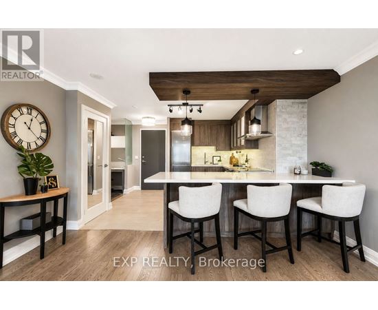 A modern kitchen with a dining table set for four.