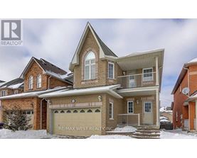 A house with a garage is for sale in the winter.