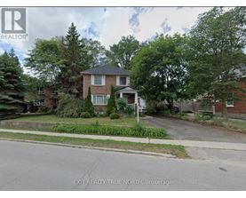 A house with a lawn in front of it is for sale.