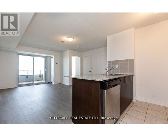 A kitchen area with a sink and a countertop.