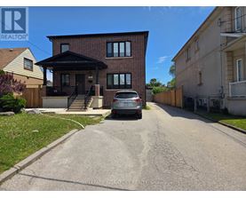 A house with a car parked in front of it.