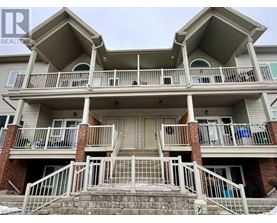 A two-story building with a balcony on the second floor.