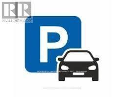 A blue and white parking sign with a car underneath it.