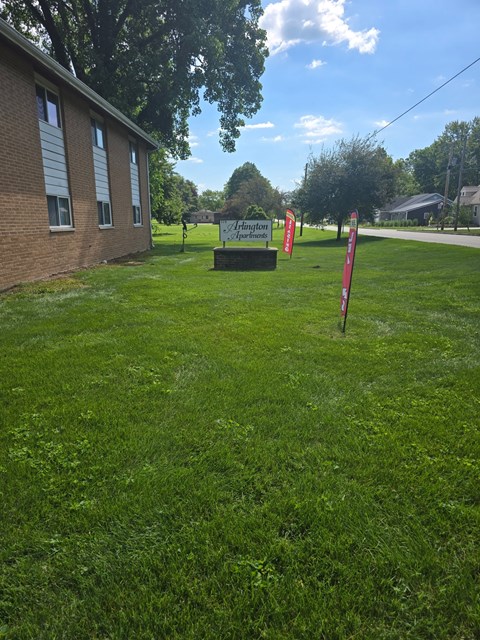 A grassy area with a sign that says "Lafayette".