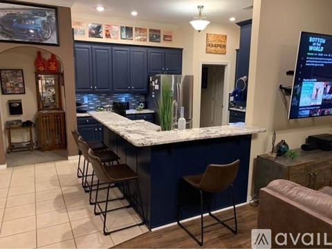 A bar area with a counter and chairs.