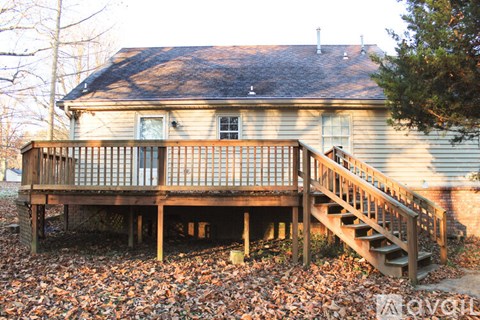 A house with a deck and stairs.