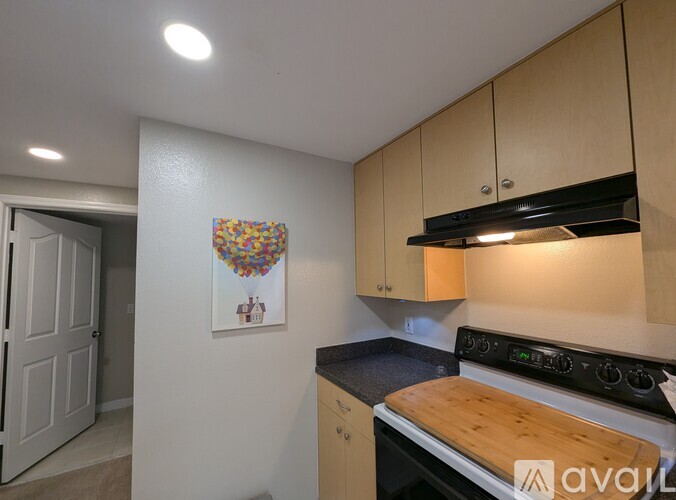 A kitchen with a stove and cabinets.
