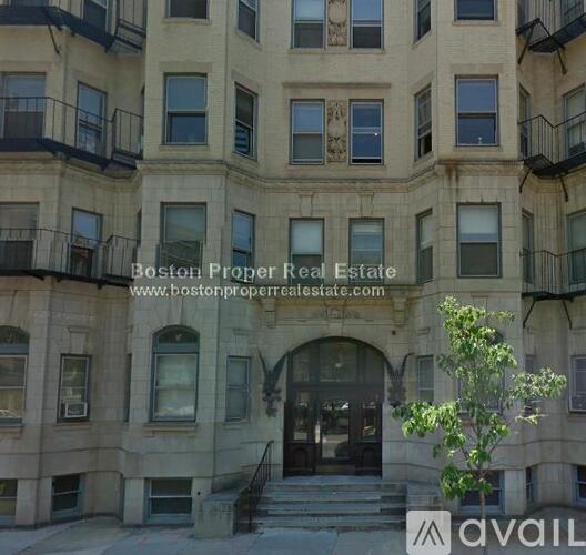 A building with the text "Boston Proper Real Estate" on it.