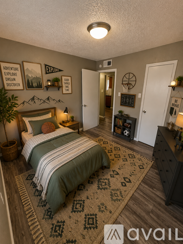 A bedroom with a bed, dresser, and a rug with a pattern.