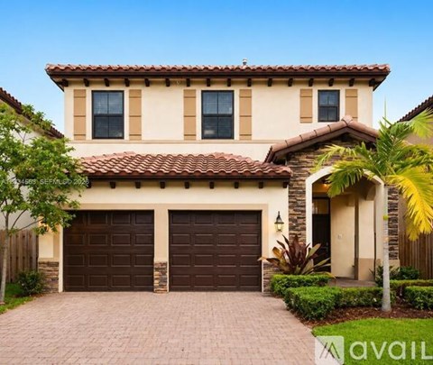 A house with a red tile roof and a garage door.