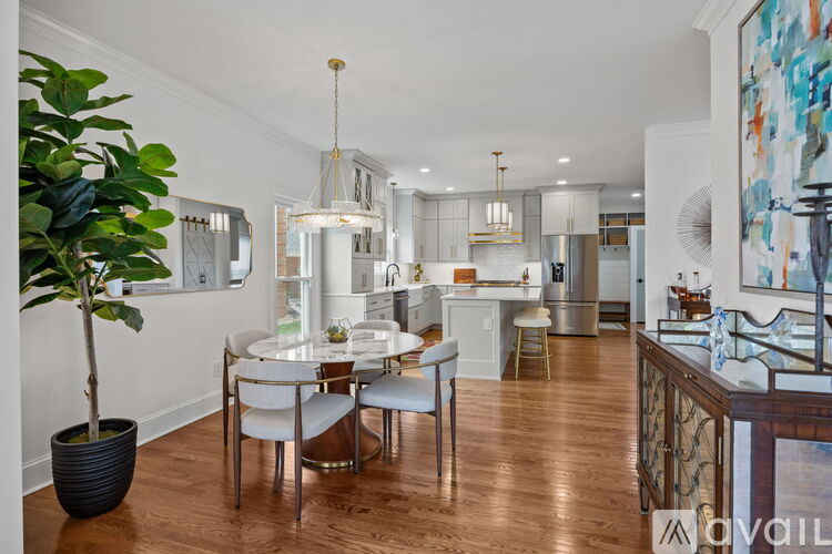 A kitchen with a blue stove and white cabinets.