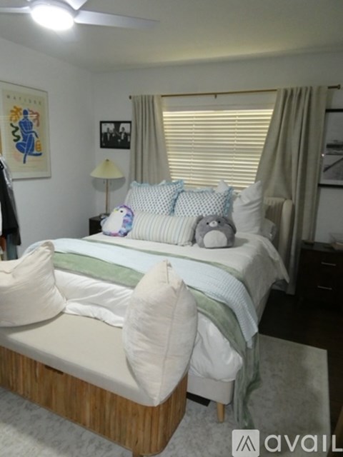 A bedroom with a bed and a couch.