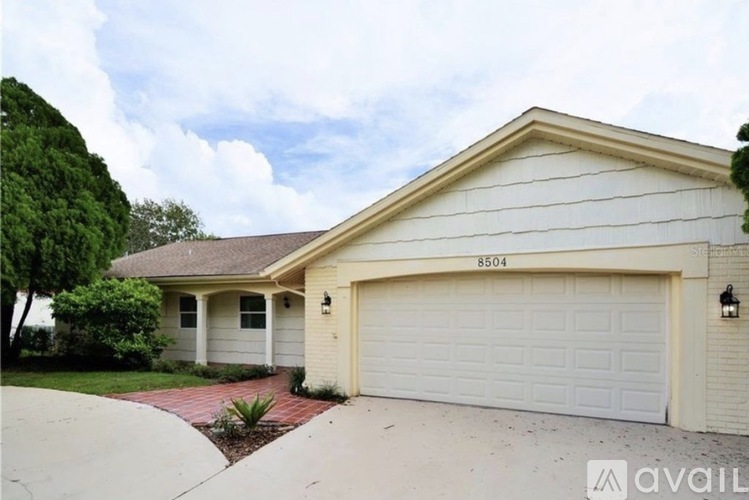 A house with the number 8504 on the garage door.