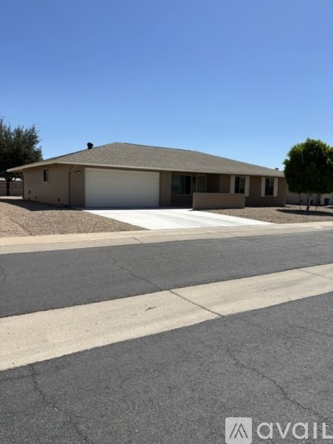 A house with a garage is available for sale.