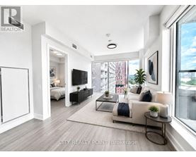 A modern living room with a large window and a view of a cityscape.
