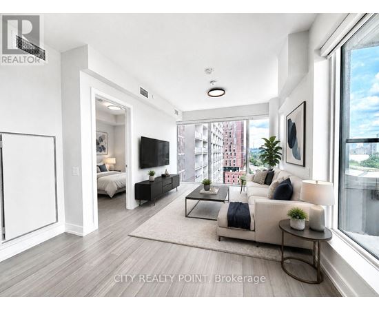 A modern living room with a large window and a view of a cityscape.