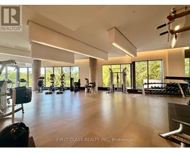 A spacious gym with a variety of equipment is shown in the image.