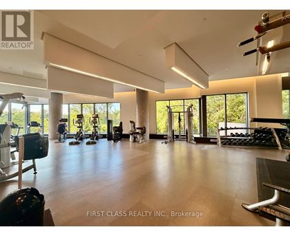 A spacious gym with a variety of equipment is shown in the image.