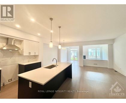 A modern kitchen with a sink and cabinets.