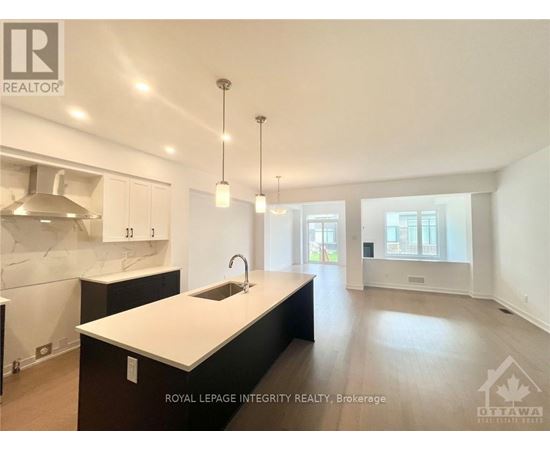 A modern kitchen with a sink and cabinets.