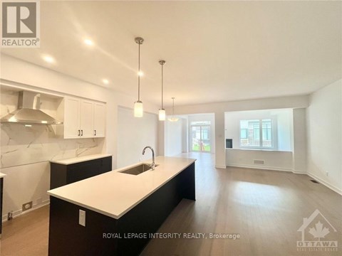 A modern kitchen with a sink and cabinets.