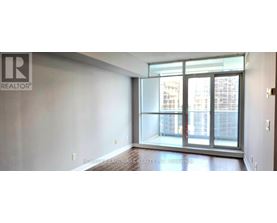 A room with a large window and a sign that says REALTOR.