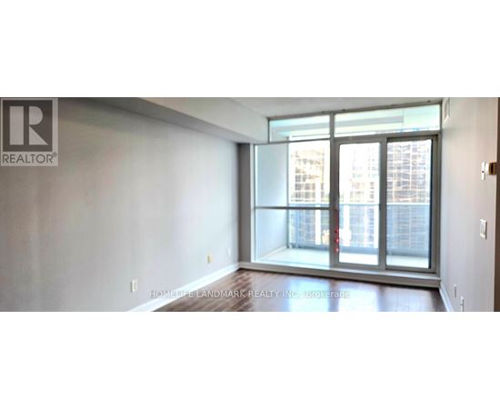 A room with a large window and a sign that says REALTOR.