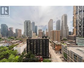 A cityscape with a building in the foreground that has the words "First Class Realty" on it.