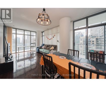 A dining room with a long table set for a meal.