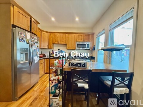 A kitchen with wooden cabinets and a refrigerator with magnets on it.