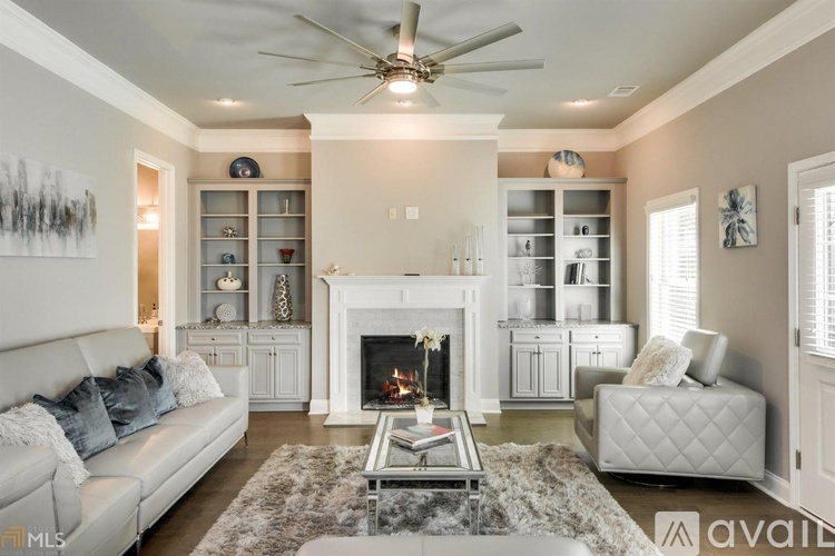A living room with a fireplace and a couch.