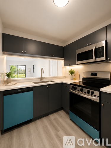 A modern kitchen with black cabinets and a blue dishwasher.